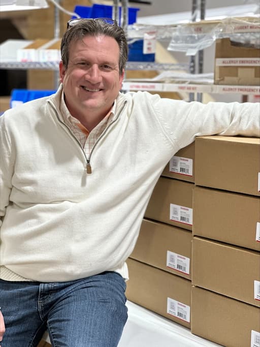 Brandon Wilson with Naloxone Boxes Ready for Shipment